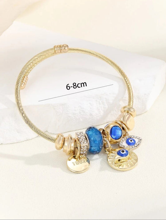 Zuri Z1023 Stainless Steel Gold Rhinestone blue Eye & Round Charm Bangle For Women For Daily Decoration. - Trillingo Express Online Marketplace