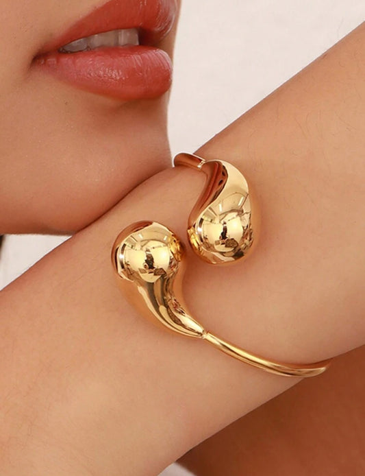 Zuri Z1029 Stainless Steel Gold Hollow Smooth Water Drop Bracelet, Spring Line Gold Comma Open Bracelet, Titanium Steel, Not Easy To Fade, Electroplated 18k. - Trillingo Express Online Marketplace